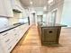 Large kitchen with an island, a gas stove, and white cabinets at 174 Fulworth Nw Dr # 65, Concord, NC 28027
