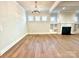 Living room with hardwood floors, a fireplace, and built-in shelving, bright and spacious at 174 Fulworth Nw Dr # 65, Concord, NC 28027