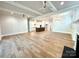 Open floor plan showcasing hardwood flooring connecting living and kitchen areas at 174 Fulworth Nw Dr # 65, Concord, NC 28027