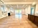 Spacious open-concept living area with hardwood floors, a fireplace, and a wall of sliding glass doors at 174 Fulworth Nw Dr # 65, Concord, NC 28027