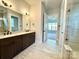 Bathroom featuring dual sinks, a spacious glass shower, and tile flooring at 178 Fulworth Nw Dr # 64, Concord, NC 28027