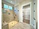 Modern bathroom with glass shower and view to closet at 178 Fulworth Nw Dr # 64, Concord, NC 28027