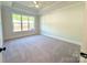 Bright bedroom with tray ceiling and large window at 178 Fulworth Nw Dr # 64, Concord, NC 28027