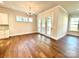 Dining area featuring hardwood floors, contemporary light fixtures, and access to the patio at 178 Fulworth Nw Dr # 64, Concord, NC 28027