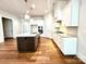 Contemporary kitchen with a large island, stainless steel appliances, and hardwood floors at 178 Fulworth Nw Dr # 64, Concord, NC 28027
