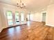 Large living room featuring hardwood floors and plenty of natural light at 178 Fulworth Nw Dr # 64, Concord, NC 28027