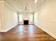 Bright living room featuring hardwood floors and a cozy fireplace at 178 Fulworth Nw Dr # 64, Concord, NC 28027