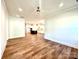 Open-concept living room leading to a modern kitchen with stainless steel appliances at 178 Fulworth Nw Dr # 64, Concord, NC 28027