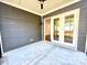 This is a view of a patio with a sliding glass door leading inside at 178 Fulworth Nw Dr # 64, Concord, NC 28027