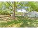 Large backyard with mature trees, new fence, and shed. Ideal for outdoor activities at 1905 Wood St, Gastonia, NC 28052