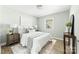 Calming bedroom with light colored walls, a queen bed, and natural light at 1905 Wood St, Gastonia, NC 28052