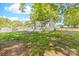 Charming single-story home with light-green siding and a sunroom addition surrounded by mature trees and a well-maintained yard at 1905 Wood St, Gastonia, NC 28052