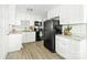 Modern kitchen with white cabinets, stainless steel appliances, and granite countertops at 1905 Wood St, Gastonia, NC 28052