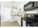Updated kitchen with granite countertops, white cabinetry, and stainless steel appliances at 1905 Wood St, Gastonia, NC 28052