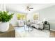 Inviting living room bathed in sunlight showcasing an open and airy design with wood flooring at 1905 Wood St, Gastonia, NC 28052