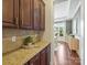 Butler pantry with custom cabinetry and granite countertop at 2030 Gloucester St, Weddington, NC 28104