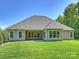 Rear exterior of home featuring a well-manicured lawn at 2030 Gloucester St, Weddington, NC 28104