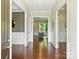 Elegant foyer featuring hardwood floors, white wainscoting, and views into the living spaces with abundant natural light at 2030 Gloucester St, Weddington, NC 28104