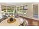 Bright living room featuring hardwood floors, neutral tones, and many windows with lovely views at 2030 Gloucester St, Weddington, NC 28104
