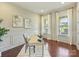 Home office featuring hardwood floors, wainscoting, modern decor, and large windows offering plenty of natural light at 2030 Gloucester St, Weddington, NC 28104