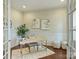 Bright home office with natural light, a stylish desk, hardwood floors, and tasteful decor for a productive workspace at 2030 Gloucester St, Weddington, NC 28104