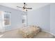 Bedroom with two windows and a floral patterned comforter at 2146 Holden Sw Ave, Concord, NC 28025