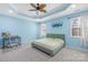 Spacious bedroom with tray ceilings, a ceiling fan, and a desk at 2146 Holden Sw Ave, Concord, NC 28025