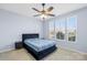 Cozy bedroom with plush carpet, a statement headboard, and large windows providing ample natural light at 2146 Holden Sw Ave, Concord, NC 28025
