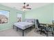 Bright bedroom with neutral walls, a ceiling fan, and a desk at 2146 Holden Sw Ave, Concord, NC 28025