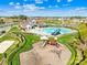Aerial view of community amenities featuring a pool, clubhouse, playground and other outdoor activities at 2146 Holden Sw Ave, Concord, NC 28025