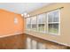 Bright dining area featuring large windows, hardwood floors, and a modern chandelier for elegant dining at 2146 Holden Sw Ave, Concord, NC 28025