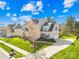 Inviting two-story home with a manicured lawn, a long driveway, and a side-entry two-car garage at 2146 Holden Sw Ave, Concord, NC 28025