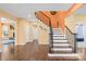 Welcoming foyer with hardwood floors, staircase, and neutral walls at 2146 Holden Sw Ave, Concord, NC 28025