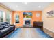 Spacious living room with a stone fireplace, offering a comfortable gathering space with abundant natural light at 2146 Holden Sw Ave, Concord, NC 28025