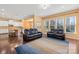 Open concept living room connects to the kitchen, featuring hardwood floors and abundant natural light at 2146 Holden Sw Ave, Concord, NC 28025