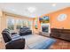 Expansive living room boasting abundant natural light, a fireplace, and comfortable leather seating at 2146 Holden Sw Ave, Concord, NC 28025