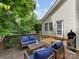 Backyard area featuring a spacious wooden deck with outdoor furniture for relaxation and enjoyment at 2214 Olde Chantilly Ct, Charlotte, NC 28205
