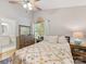 Bright bedroom featuring a large window, a comfortable bed, and classic decor, creating a cozy retreat at 2214 Olde Chantilly Ct, Charlotte, NC 28205