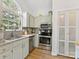 Modern kitchen featuring stainless steel appliances, sleek countertops, and ample cabinet space at 2214 Olde Chantilly Ct, Charlotte, NC 28205
