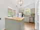 Bright kitchen features a large island, stainless steel appliances, and plenty of natural light at 2214 Olde Chantilly Ct, Charlotte, NC 28205