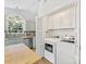 Kitchen featuring a laundry closet with washer and dryer next to stainless steel appliances at 2214 Olde Chantilly Ct, Charlotte, NC 28205