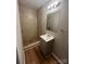 Bathroom featuring tiled walk-in shower, vanity and updated fixtures at 2300 Olando St, Charlotte, NC 28206