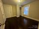 Bedroom featuring hardwood floors, closet and window with blinds at 2300 Olando St, Charlotte, NC 28206