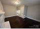 Bedroom showcasing hardwood floors, fresh paint, and natural light at 2300 Olando St, Charlotte, NC 28206