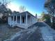 A single Gathering home with porch with a gravel driveway at 2300 Olando St, Charlotte, NC 28206