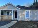 Charming single-story home featuring a covered porch and neutral siding at 2300 Olando St, Charlotte, NC 28206