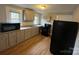 Neutral kitchen features updated countertops, cabinets, and appliances at 2300 Olando St, Charlotte, NC 28206