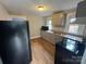 This kitchen offers updated appliances and light gray cabinets at 2300 Olando St, Charlotte, NC 28206