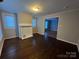 Living room with hardwood floors and fireplace mantel at 2300 Olando St, Charlotte, NC 28206