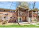 Two-story brick home with dual patios and wooden balconies overlooking green lawn at 2629 Vail Ave, Charlotte, NC 28204